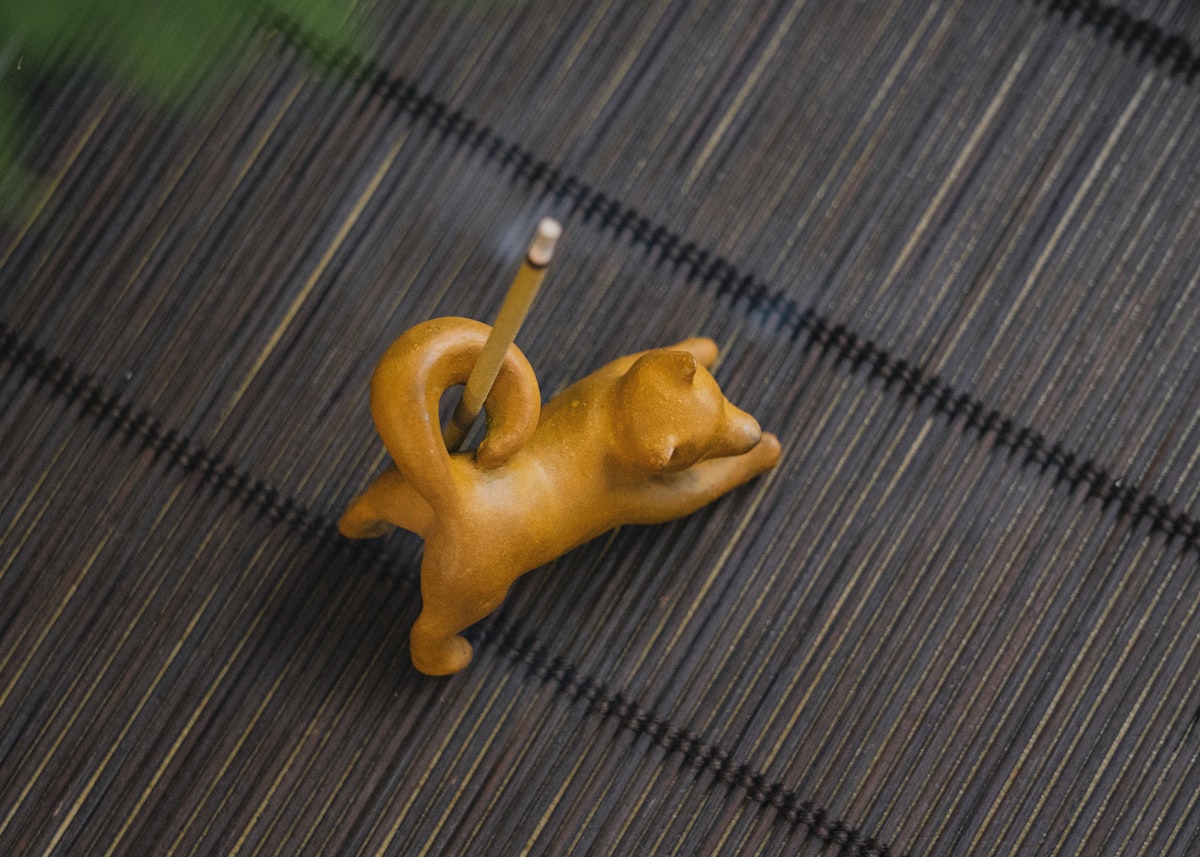 Golden Retriever puppy working on a puzzle toy filled with treats, focused and engaged